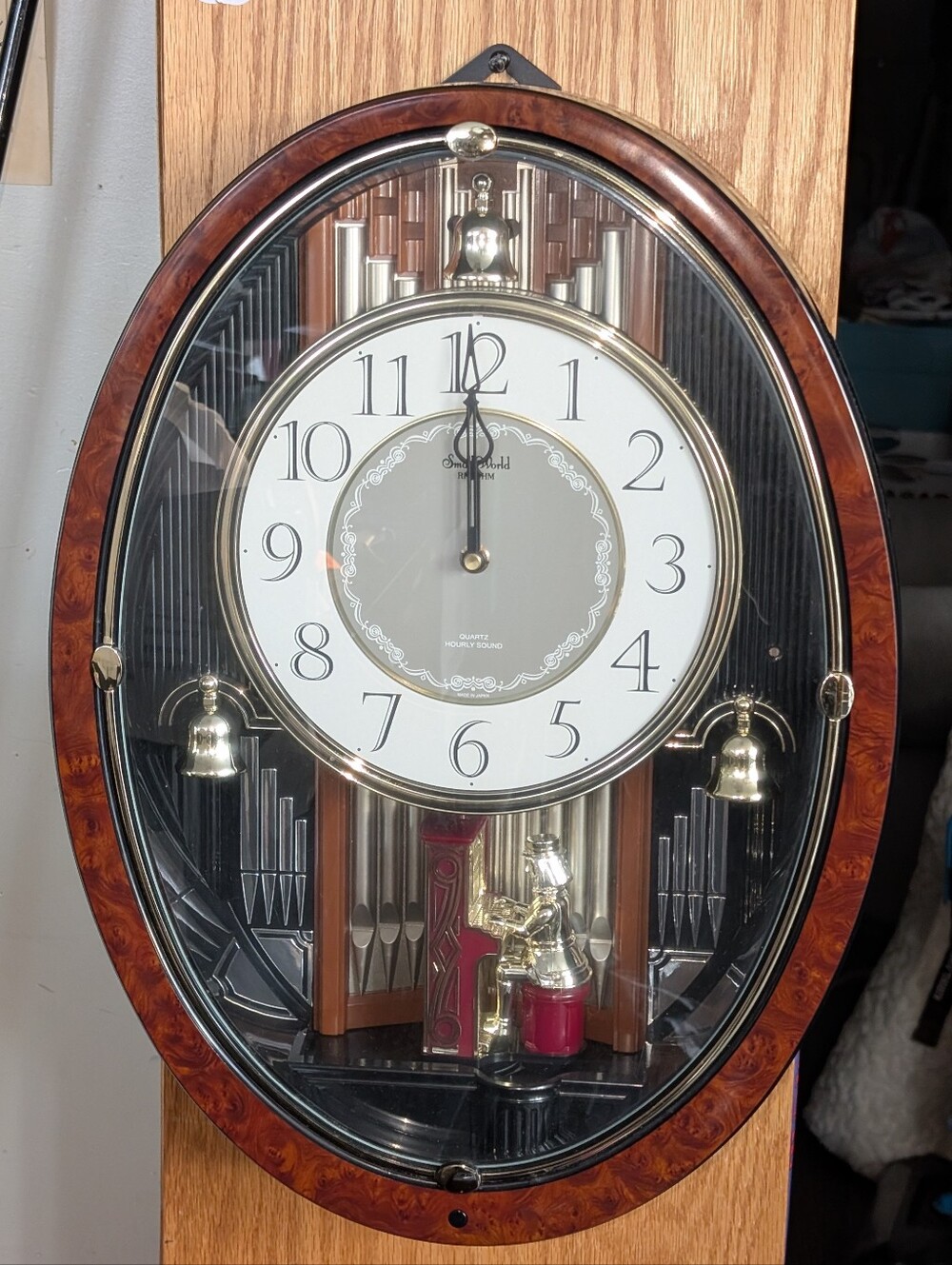 Small World Rhythm Musical Wall Clock with Brown WoodTone Frame and Gold Accents